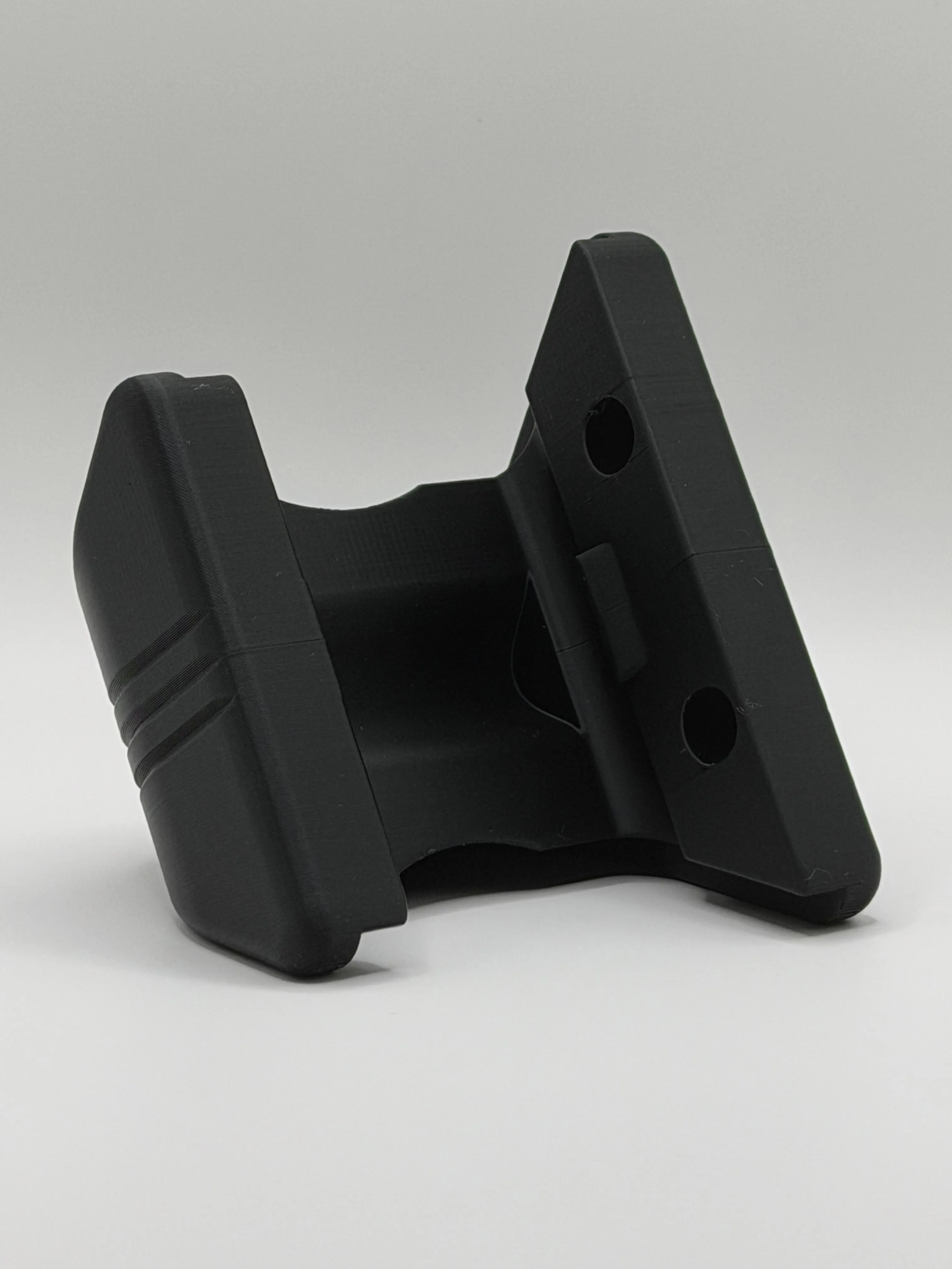 Back of the mount showing the wall plate and two screw holes