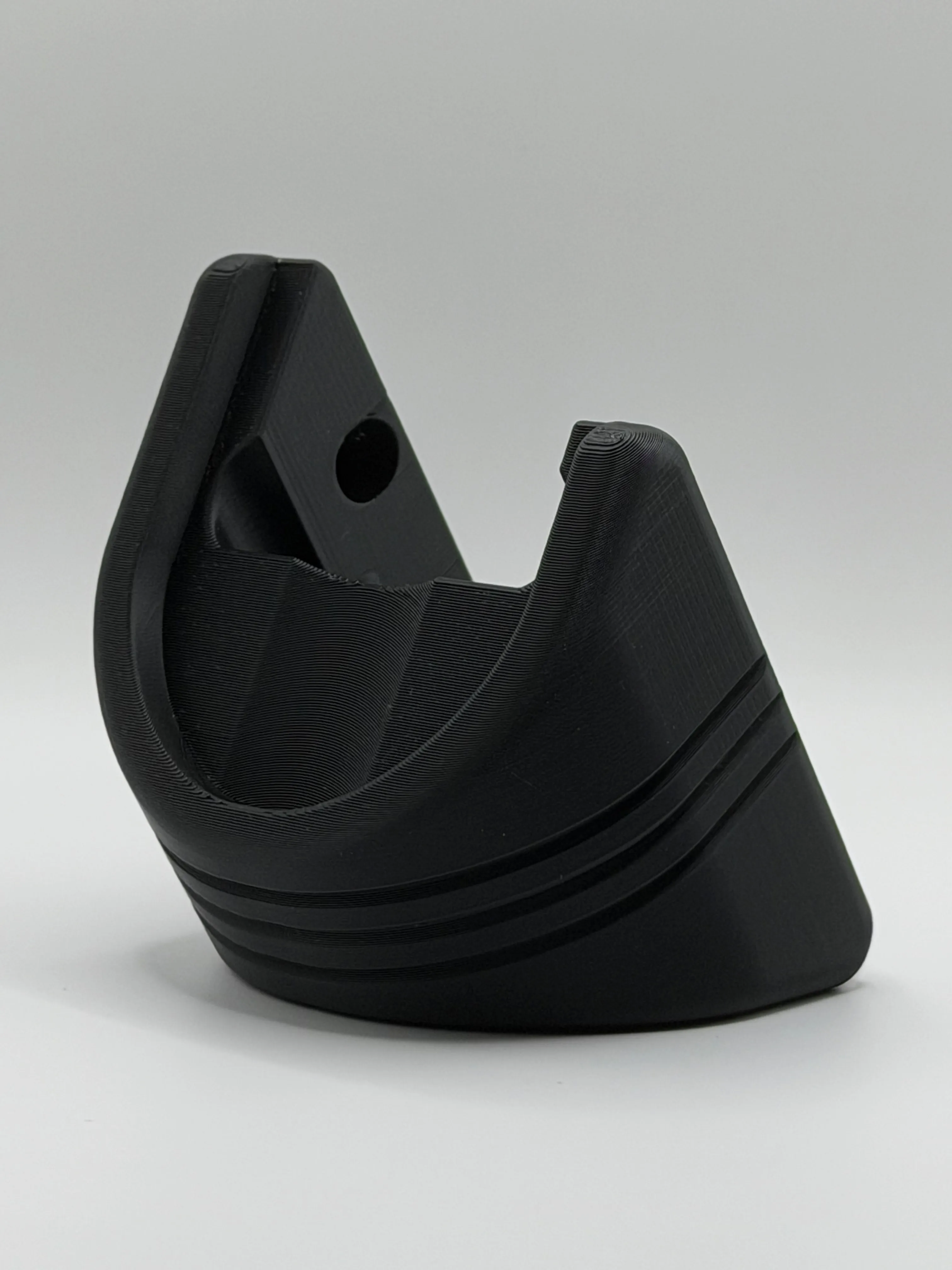 Front view of the black PLA+ mount showing the fitted cradle